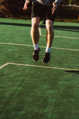 Young man doing workout in Austria on a basketball court