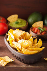 mexican guacamole and salsa dip with nachos tortilla chips