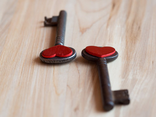 Old keys and red hearts background