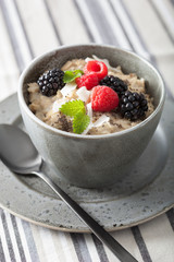 healthy breakfast oatmeal porridge with raspberry blackberry