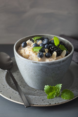 healthy breakfast steel cut oatmeal porridge with blueberry blackberry