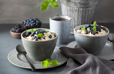 healthy breakfast steel cut oatmeal porridge with blueberry blackberry