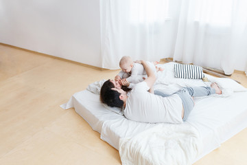 Happy parents and their child at home