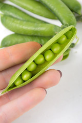 Green peas on a white background