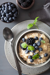 healthy breakfast steel cut oatmeal porridge with blueberry blackberry