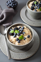 healthy breakfast steel cut oatmeal porridge with blueberry blackberry
