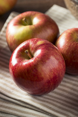 Fototapeta na wymiar Raw Red Organic Kiku Apples