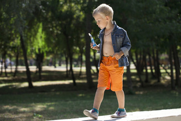 Portrait of a young boy in a jeans jacket
