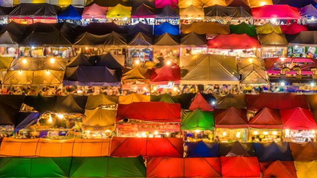 Bangkok Train Night Market. Rot Fai Market. Time lapse. Camera moves from to right