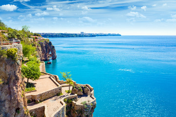 Terrace on cliff near blue Gulf of Antalya in popular seaside resort city Antalya, Turkey - obrazy, fototapety, plakaty