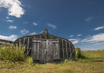 Obraz premium Boat storage sheds on Lindisfarne Island