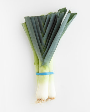 bundle of leek on white background