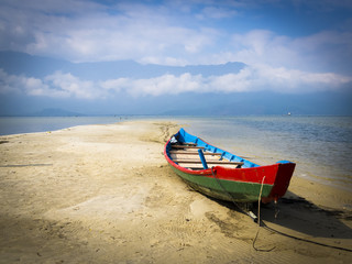 Colorful boat in the sand