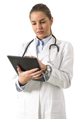 Young female doctor using digital tablet