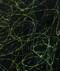 green glowing neon curved stripes on an abstract dark background