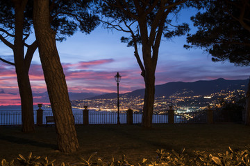 Night panorama of the Italian coast with the city of Sanremo in the background.