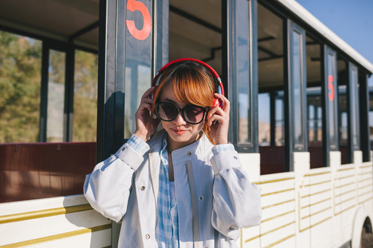 young fashion lady listen music with wireless headset