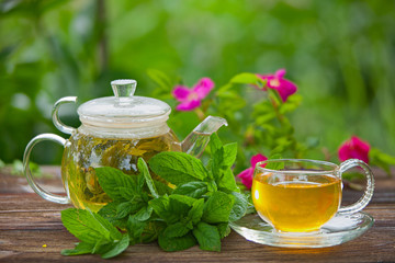 delicious green tea in a beautiful glass bowl on table