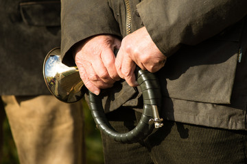 French horn band held in hands by a hunter on Saint Hubertus Day, 05/11/2017, De Moer, The...
