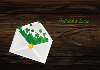 Envelope with green clover inside. St.Patrick 's Day. Vector illustration. Greeting card with empty space for text or advertising. On wooden background