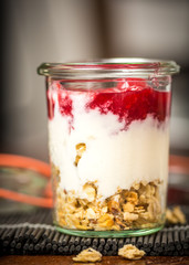 Closeup of Granola with Red Berries and Kefir