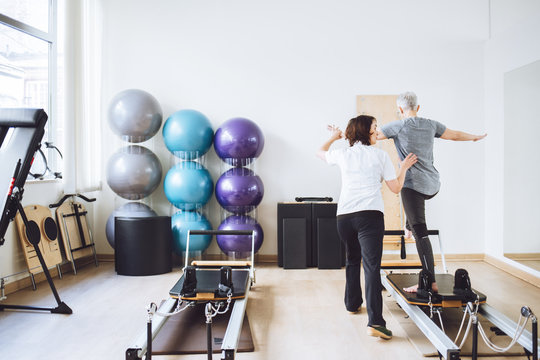 Woman Doing Fitness Exercise With Therapist
