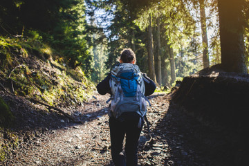 Teen Hiker Walks in Forest