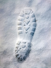 Footprint in snow. Hiking in winter.