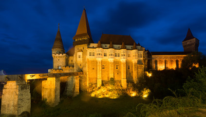 Fototapeta na wymiar Illuminated Corvin Castle in night, Romania