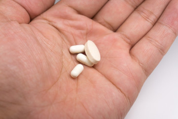 pill in human's hand