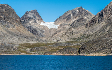 Fototapeta na wymiar Coastal mountain scenery in in the Hamburger Sund, north of Maniitsoq, West Greenland