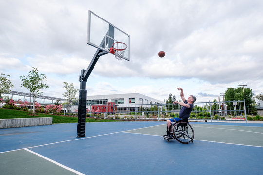 Active Disabled Athlete Practicing Wheelchair Basketball
