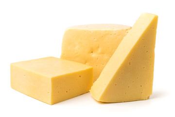 Pieces of cheese of different shapes on a white background.
