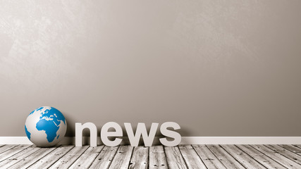 News Text and Earth Globe on Floor Against Wall