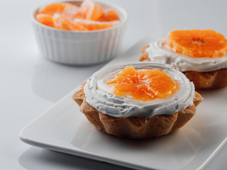 tartlets with cream and tangerines