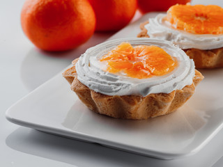 tartlets with cream and tangerines