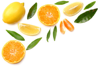 mandarin with slices, lemon and green leaf isolated on white background top view