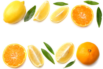 mandarin with slices, lemon and green leaf isolated on white background top view