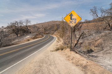 Road sign damaged by Thomas Fire along Highway 150