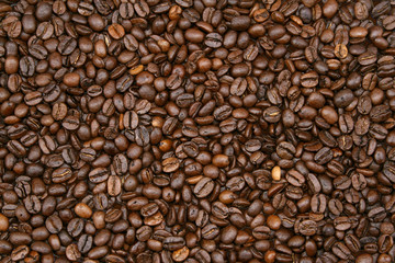 Close-up of brown roasted coffee beans background