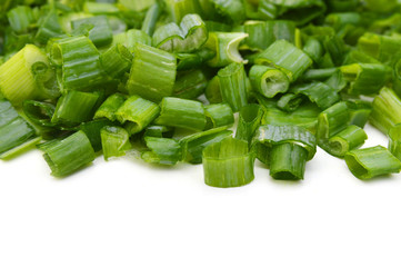 Chopped green onions on white