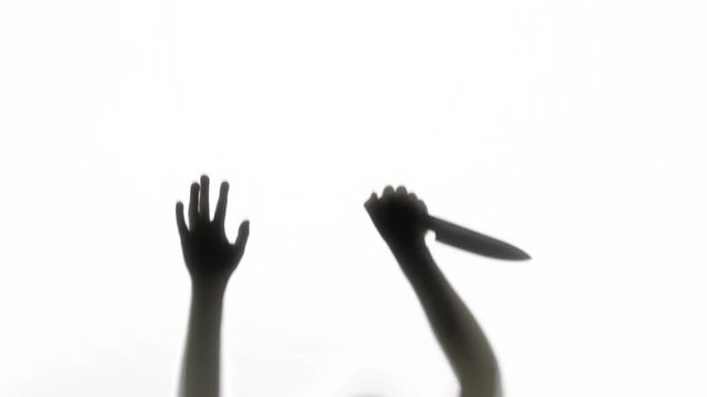 Silhouette of a knife wielding killer. Great for Halloween.