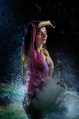 Foto op Plexiglas Water splashes against a seductive woman in the shirt © IVASHstudio