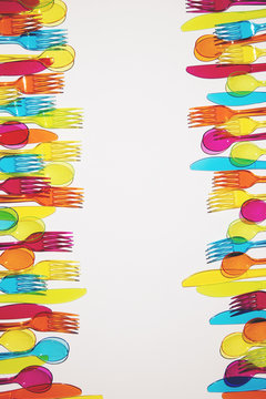 Rows of coloured cutlery