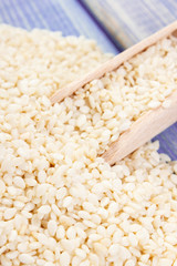 Heap of sesame seeds on wooden boards