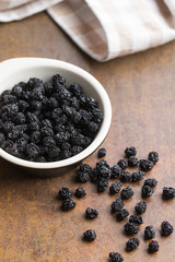 Dried chokeberries. Black aronia berries.