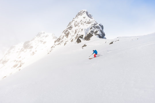 Man skiing off piste outdoor in beautiful mountain environment