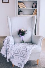 beautiful wedding bouquet in a classic white Chair
