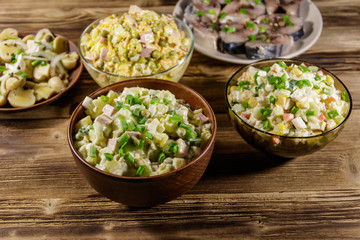 Various festive dishes on wooden table