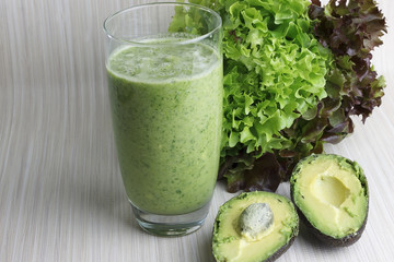 Fresh green smoothie with avocado, spinach, parsley, wild rocket and lemon. Detoxication juice.